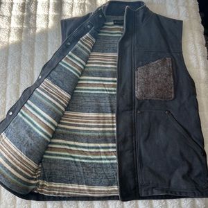United by Blue vest.